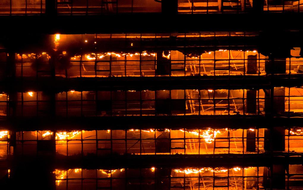 Building frame exposed to fire at night